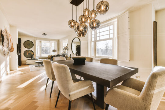 Dining room with furniture and pendant lights
