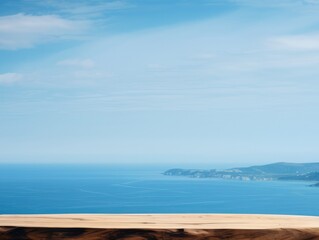 Wooden table on the backdrop of a blue sea, white sand beach, clear blue sky.