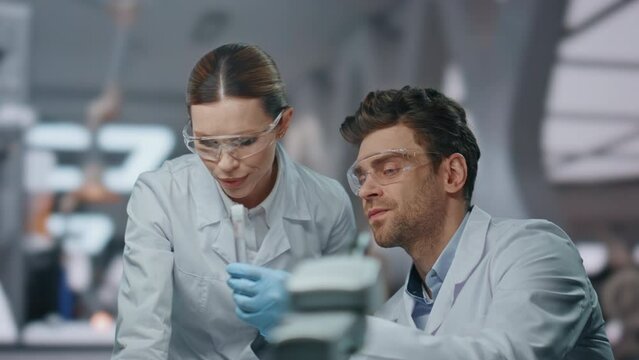 Team biologists developing medical project in advanced laboratory close up. 
