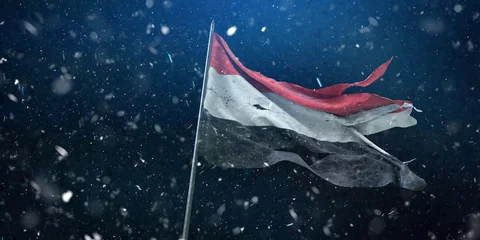 Foto op Plexiglas  Yemen, Republic of Yemen flag, the torn flag waving in the wind and storm. 3D Design. © Bilal Ulker