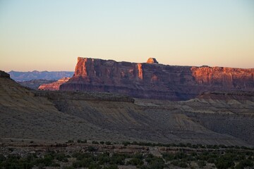 Interstate 70 winds through the San Rafael Swell, a high desert region of unique landforms like mesas and buttes and pastures on top