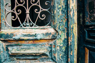 Detail of beautiful, ornate old door knocker on an antique portal.