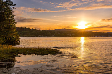 yellow, orange, and blue colour sunset or dusk over Hardy Bay on northern Vancouver Island, Canada