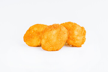 Breaded Chicken Inner Fillet on a White Background,Chicken Breaded Raw Meat.Chicken Breaded Fillet.Fast food. Fast cooking. Breaded chicken nuggets. Homemade food at home.