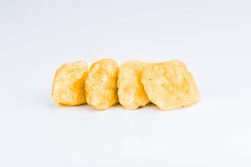 Chicken Breaded Fillet.Fast food. Breaded Chicken Inner Fillet on a White Background,Chicken Breaded Raw Meat. Fast cooking. Breaded chicken nuggets. Homemade food at home.