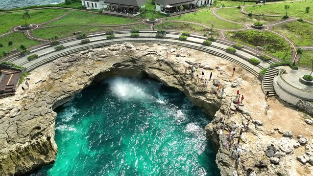 INDONESIA - AUGUST.9.2023 - Excellent aerial footage circling the Devil's Tears pool in Nusa Lembongan, Indonesia.