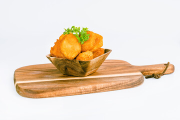 Chicken Breaded Fillet.Fast food. Breaded Chicken Inner Fillet on a White Background,Chicken Breaded Raw Meat. Fast cooking. Breaded chicken nuggets. Homemade food at home.