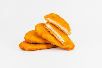 Chicken fillets fried until half cooked, semi-finished product with fresh herbs on a white background. Fast cooking.Fast homemade food.Fast food. Quick cooking at home. Copy space.