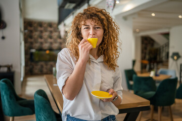 Woman adult caucasian female happy smile hold cup of coffee at cafe