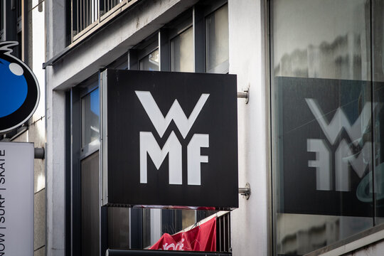 COLOGNE, GERMANY - NOVEMBER 12, 2022:WMF logo in front of one of their retailers in cologne. WMF Group is a german tableware, kitchenware and cutlery manufacturer and seller.