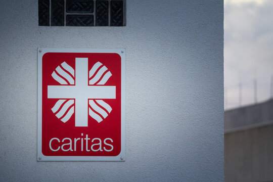 AACHEN, GERMANY - NOVEMBER 8, 2022: Logo of Caritas International (Caritas Deutschland) on their Aachen office. Caritas is a catholic relief and humanitarian aid organization.