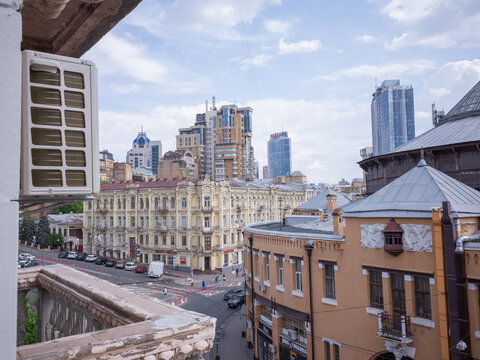 historical and modern buildings seen from the terrace of apartment in capital kyiv
