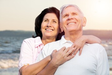 Obraz premium Happy senior couple spending time at the beach.