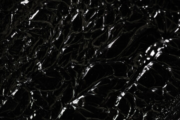 Abstract black paint on an artistic painting. Background texture of interesting terrain surface