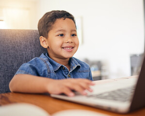 Naklejka premium Happy little boy, laptop and elearning in virtual classroom at home for education, learning or communication. Face of child, student or kindergarten working on computer for online learning in house