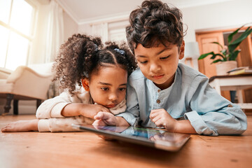 Children, tablet and home education, online development and internet games for kindergarten or home...
