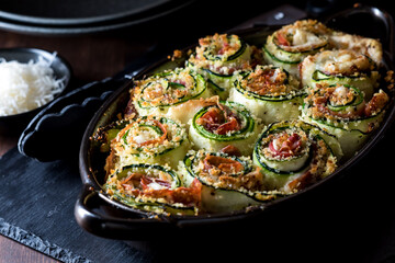 A fresh hot out of the oven zucchini roll ups appetizer, ready for sharing.