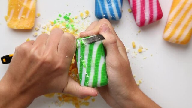 Cutting ASMR soap with a thin stationery knife .Cutting soap into pieces squares
