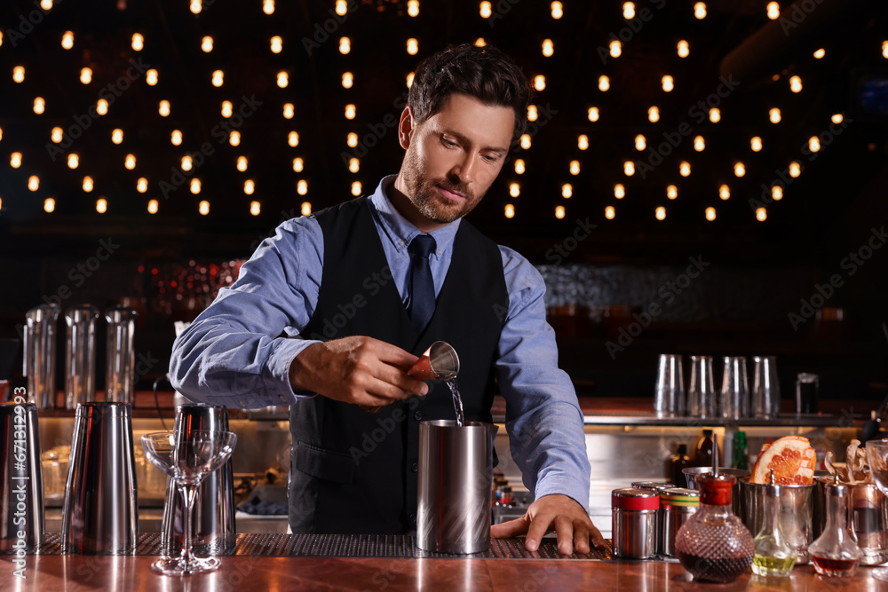 Poster Bartender preparing fresh alcoholic cocktail in bar