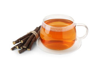 Aromatic licorice tea in cup and dried sticks of licorice root isolated on white