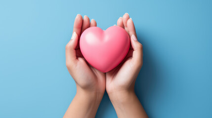 hands hold a pink heart on a minimal light blue background