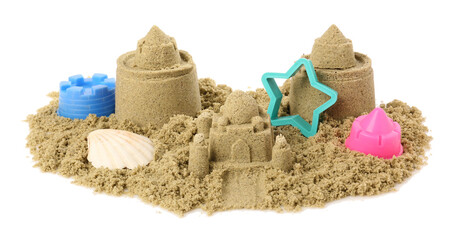 Pile of sand with beautiful castles, plastic toys and shell isolated on white