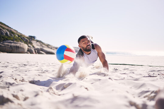 Fitness, beach or man diving for volleyball in competition, match or sports contest playing on sand. Workout, training or athlete jumping to hit ball at sea for summer game, activity motion or action