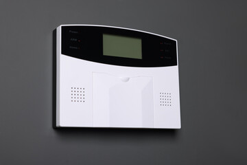 Home security alarm system on gray wall
