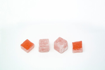 Lokum in rose flavor, white background. 