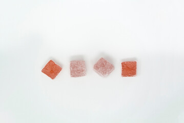 Lokum in rose flavor, white background. 