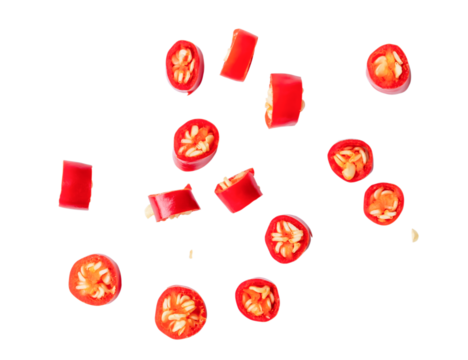 Top view of colorful red chili slices or pieces isolated on white background with clipping path in png file format