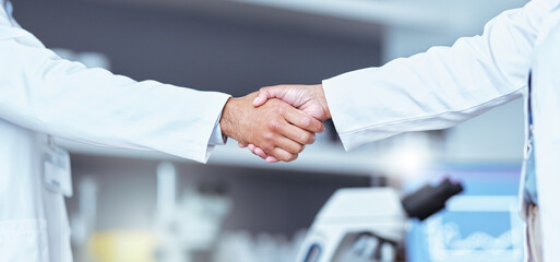 Hand shake, partnership and lab scientist, people or team work, collaboration and cooperation on medical science. Doctors, teamwork and closeup partner handshake for unity, agreement or staff welcome