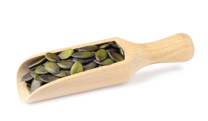 Wooden scoop with pumpkin seeds isolated on white