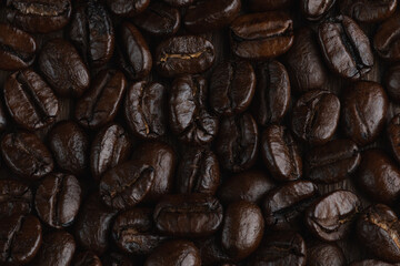 Roasted coffee bean on wooden table..