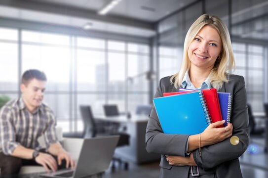 Mature smart businesswoman standing in office, AI generated image