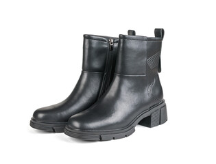 A pair of women's leather ankle boots with heels isolated on a white background.