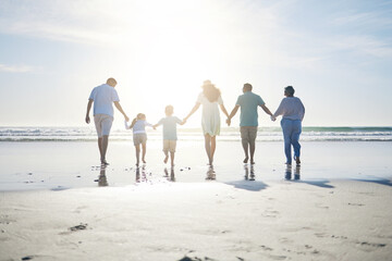 Beach, holding hands and grandparents, parents and kids for bonding, quality time and relax in nature. Family, travel and back of mom, dad and children walking on holiday, vacation and adventure