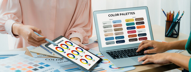 A cropped picture of professional designer selects the color by using color theory while using...