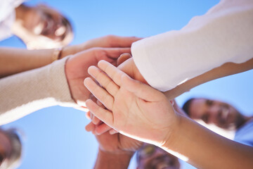 People, hands together and teamwork below in support for trust, bonding or unity and collaboration...