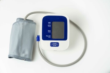 Automatic portable blood pressure machine with arm cuff isolated on white with copy space, studio shot. tonometer, hospital, research