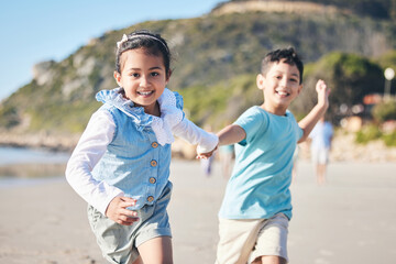 Children, brother and sister running at beach, portrait and holding hands with smile, adventure and...