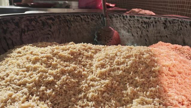 Large cauldron for pilaf with steaming rice
