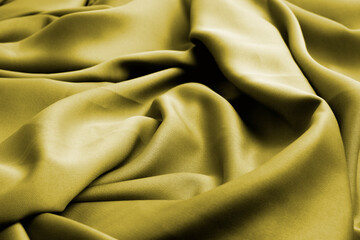 Abstract texture of gold color fabric as concept background. Fabric texture of natural cotton or linen textile material