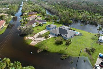 Consequences of natural disaster. Heavy flood with high water surrounding residential houses after...