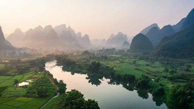 Aerial footage of beautiful mountain and river natural landscape in Guilin at sunrise, China. Famous tourist destination.