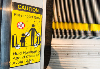 caution sign stands tall against a backdrop of hard hats and heavy machinery, symbolizing safety,...