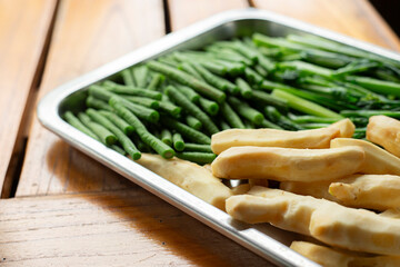 vegetarian in stainless steel tray on wooden table