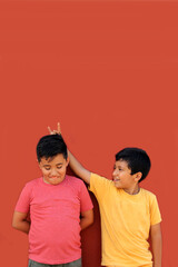 9-year-old Latino children get upset and bully each other as a form of physical, psychological,...
