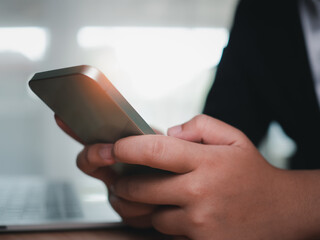 Social media and technology concepts , Human hand is holding a phone and there is a social media icon.