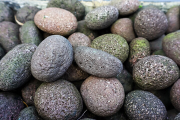 Fototapeta na wymiar Pebble stones in the garden. Abstract nature background